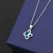 Clover A pendant with blue diamond cross-chain