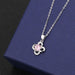 Clover A pendant with pink diamond on cross chain