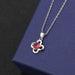 Clover A pendant with red diamond cross-chain