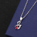 Swan pendant with red diamond cross chain