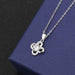 Clover A pendant with a cross chain of white diamonds