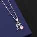 Dolphin pendant with pink diamond on the melon seed chain