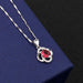 Clover B pendant with red diamond on the melon seed chain