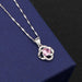 Clover B pendant with pink diamonds on a melon seed chain