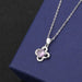 Clover A pendant with purple diamond on cross chain