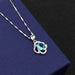 Clover B pendant with blue diamond on the melon seed chain